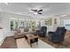 Spacious living room with large windows and ample seating, connected to the kitchen at 4961 Thornwood Nw Trce, Acworth, GA 30102