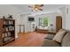 Comfortable living room with a ceiling fan and large windows, great for Gathering time at 4961 Thornwood Nw Trce, Acworth, GA 30102