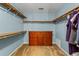 Walk-in closet with built-in shelving, providing ample storage space and organization at 4961 Thornwood Nw Trce, Acworth, GA 30102