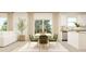 Elegant dining area featuring a stylish table set with seating for six, adjacent to the kitchen and living area at 1404 Hunter Trl, Acworth, GA 30102