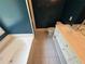 This bathroom features a bath tub, double sink vanity, and commode at 1855 Tribble Ridge Dr, Lawrenceville, GA 30045