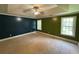 Spacious bedroom features tray ceilings, carpet flooring, and ample natural light at 1855 Tribble Ridge Dr, Lawrenceville, GA 30045