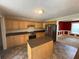 Well-appointed kitchen boasts modern appliances, a granite island, and an open layout leading to the dining and living spaces at 1855 Tribble Ridge Dr, Lawrenceville, GA 30045