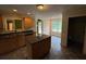 Bright kitchen featuring granite countertops, an island, and an adjacent dining area with backyard view at 1855 Tribble Ridge Dr, Lawrenceville, GA 30045