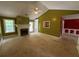 Bright living room boasts a fireplace, neutral carpet, and abundant natural light from windows and access to outdoor living at 1855 Tribble Ridge Dr, Lawrenceville, GA 30045