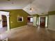 Open-concept living room showing high ceilings, views to the kitchen, and access to other rooms in the house at 1855 Tribble Ridge Dr, Lawrenceville, GA 30045
