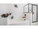 Bright bathroom features a soaking tub, subway tile, glass shower, and modern fixtures at 211 N Auburn Landing Pl, Auburn, GA 30011
