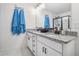 Bathroom boasts double sinks, granite countertops, sleek fixtures, and a glass-enclosed shower at 211 N Auburn Landing Pl, Auburn, GA 30011