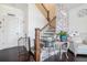 Inviting entryway features stylish decor, a staircase with iron railings, and a cozy, welcoming atmosphere at 211 N Auburn Landing Pl, Auburn, GA 30011
