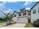 Attractive townhome boasting a two-car garage, complemented by wood shutters and a well-manicured front lawn at 211 N Auburn Landing Pl, Auburn, GA 30011