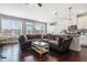 Open living space featuring a stylish kitchen with granite countertops, a dining area and a cozy living area at 211 N Auburn Landing Pl, Auburn, GA 30011