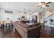 Spacious living room featuring a combined living, dining and kitchen area, and hardwood floors at 211 N Auburn Landing Pl, Auburn, GA 30011