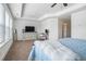 Spacious main bedroom features a tray ceiling, neutral carpet, plenty of natural light, and nice furniture at 211 N Auburn Landing Pl, Auburn, GA 30011