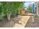 A backyard deck with an exotic hut, provides an excellent outdoor entertaining space at 29 Sedgefield Overlook, Dallas, GA 30157