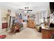 A comfy bedroom area featuring personal decorations, a large window and natural light, and decorative rugs and curtains at 29 Sedgefield Overlook, Dallas, GA 30157