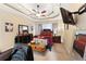 Bedroom with dark furniture, trey ceiling, ceiling fan, and wall-mounted television at 29 Sedgefield Overlook, Dallas, GA 30157