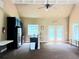 A community room with kitchen, refrigerator, and double doors that lead to the outdoor pool at 29 Sedgefield Overlook, Dallas, GA 30157