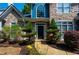 Elegant front entrance with well-manicured landscaping and a welcoming black door at 29 Sedgefield Overlook, Dallas, GA 30157