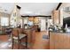 Kitchen with wooden cabinetry, bar seating, and hardwood flooring at 29 Sedgefield Overlook, Dallas, GA 30157