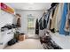 Spacious walk-in closet with metal shelving and a window providing natural light at 29 Sedgefield Overlook, Dallas, GA 30157