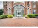 Inviting building entrance with glass doors and manicured landscaping at 325 E Paces Ferry Ne Rd # 1910, Atlanta, GA 30305