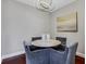 Cozy dining area with a stylish chandelier, round table, and four comfortable chairs at 325 E Paces Ferry Ne Rd # 1910, Atlanta, GA 30305