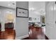 Open-concept living room showcasing hardwood floors, modern lighting, and views into the dining area at 325 E Paces Ferry Ne Rd # 1910, Atlanta, GA 30305