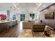 Modern living room with stylish furniture, hardwood floors, and a large window overlooking the city at 325 E Paces Ferry Ne Rd # 1910, Atlanta, GA 30305