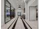 Elegant lobby with marble floors, sleek seating, and modern glass dividers, creating a welcoming entrance at 325 E Paces Ferry Ne Rd # 1910, Atlanta, GA 30305