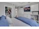 Comfortable main bedroom with a king bed, built-in cabinets, and a TV at 325 E Paces Ferry Ne Rd # 1910, Atlanta, GA 30305