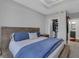 Spacious main bedroom featuring a bed, tray ceiling, and walk-in closet at 325 E Paces Ferry Ne Rd # 1910, Atlanta, GA 30305