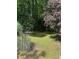 Lush backyard area with mature trees, offering a serene and private outdoor retreat at 3090 Alberta Dr, Marietta, GA 30062