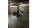 Unfinished basement with cement flooring and access to a garage door, ready for customization at 3090 Alberta Dr, Marietta, GA 30062