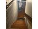 Basement stairway with cinder block walls, leading down to storage space at 3090 Alberta Dr, Marietta, GA 30062