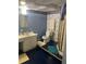 Bathroom featuring a blue patterned wall and a toilet, offering comfort and functionality at 3090 Alberta Dr, Marietta, GA 30062