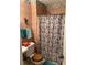 Cozy bathroom featuring a pedestal sink and a seashell pattern shower curtain at 3090 Alberta Dr, Marietta, GA 30062