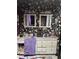 Bathroom with floral wallpaper, vanity and storage cabinets under the sink at 3090 Alberta Dr, Marietta, GA 30062