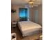 Traditional bedroom featuring a teal accent wall and ample natural light at 3090 Alberta Dr, Marietta, GA 30062