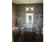 Cozy dining area with a glass table and seating for six near window at 3090 Alberta Dr, Marietta, GA 30062