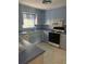 The kitchen offers plentiful cabinet space, a double sink and modern appliances at 3090 Alberta Dr, Marietta, GA 30062