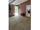 Living room features stone fireplace, door to deck and open access to kitchen at 3090 Alberta Dr, Marietta, GA 30062