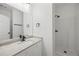 Modern bathroom with vanity, granite countertop, dark fixtures, shower, and updated lighting at 3405 Summer Brooke Way, Union City, GA 30291