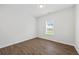 Cozy bedroom featuring hardwood floors, neutral walls, and a window that lets in natural light at 3405 Summer Brooke Way, Union City, GA 30291