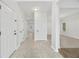 Bright and spacious entryway featuring neutral tile flooring, fresh white paint and multiple doors at 3405 Summer Brooke Way, Union City, GA 30291