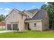 Inviting two-story home featuring a two-car garage and a mix of brick and siding at 3405 Summer Brooke Way, Union City, GA 30291