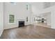 Spacious living room with hardwood floors, fireplace, and an open layout connected to the modern kitchen at 3405 Summer Brooke Way, Union City, GA 30291
