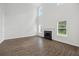 Bright living room featuring hardwood floors, fireplace, and large windows allowing for lots of natural light at 3405 Summer Brooke Way, Union City, GA 30291