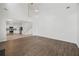Open living room with hardwood floors connecting to kitchen, and features high ceilings and staircase at 3405 Summer Brooke Way, Union City, GA 30291