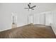 Spacious main bedroom with hardwood floors, ceiling fan, and doorway that leads to en suite bathroom at 3405 Summer Brooke Way, Union City, GA 30291