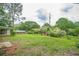 A sprawling backyard featuring lush greenery and mature trees at 4935 Golden Sw Cir, Mableton, GA 30126